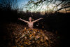 Nude Girl Buried in Autumn Leaves Playing